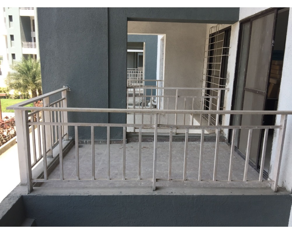  Illustration showcasing a modern balcony with a sleek and stylish railing manufactured by Om Engineers (Fabricator). The railing features a combination of stainless steel and glass panels, providing both safety and aesthetic appeal to the outdoor space.