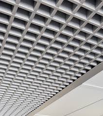 Close-up view of an open cell ceiling manufactured by Om Engineers (Fabricator), highlighting the sleek lines and geometric patterns of the metal panels. The design offers both aesthetic appeal and functional benefits such as improved acoustics and ventilation.
